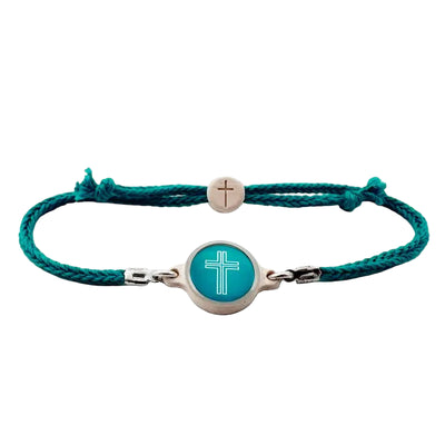 Turquoise bracelet with cross charm on a white background